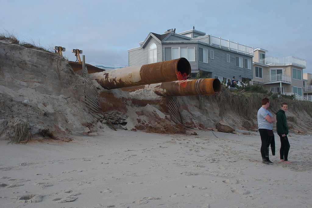 DSC_6533.jpg - These pipes for the project were parked on the street before the storm took away the sand.