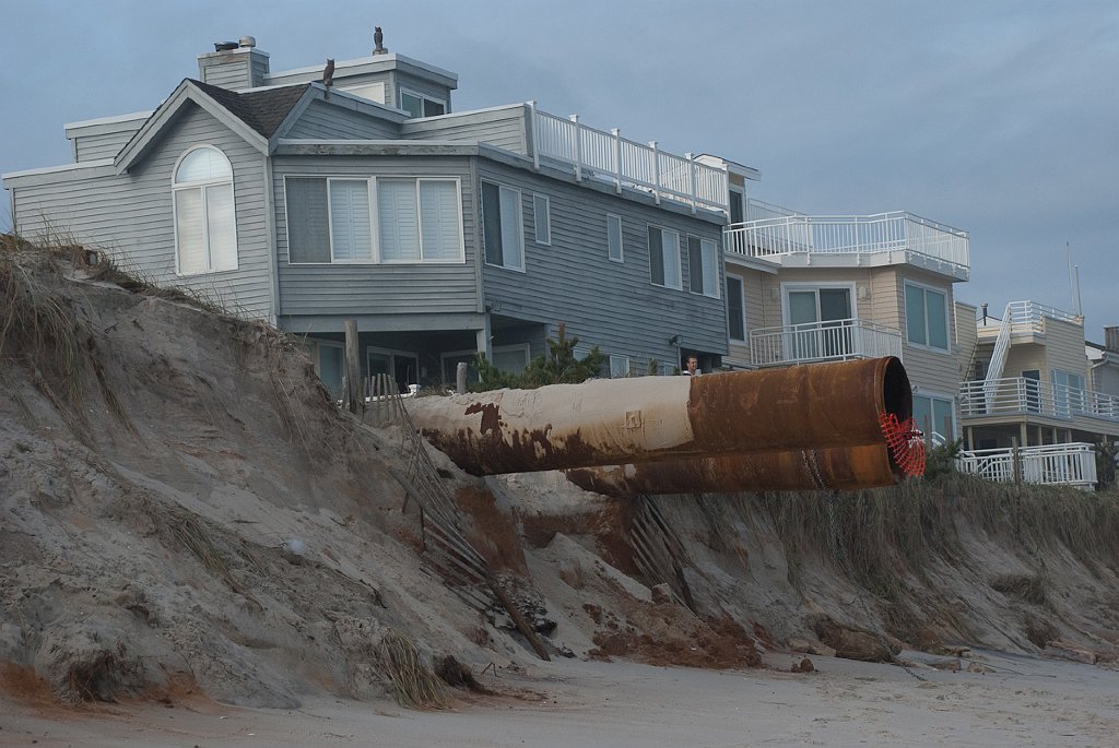 DSC_6535.jpg - These pipes for the project were parked on the street before the storm took away the sand.