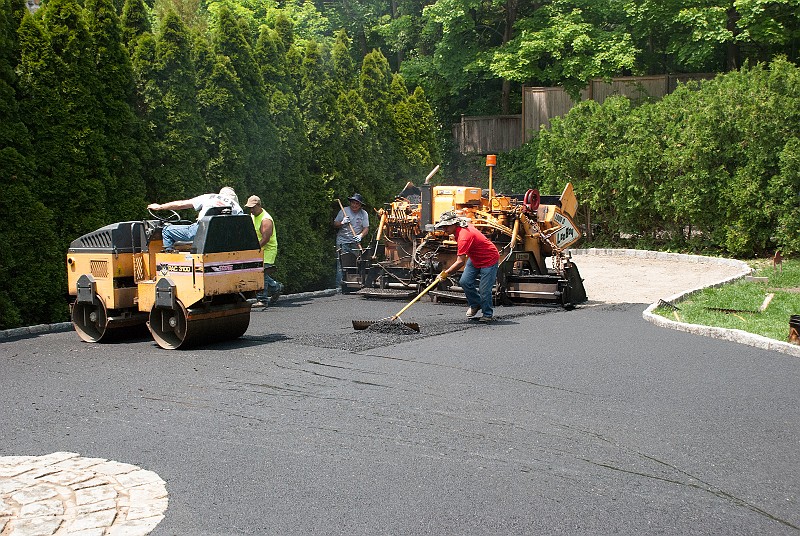 DSC_1879.jpg - The spreader/paver, now repaired by yours truly, does most of the spreading and roller goes to work.