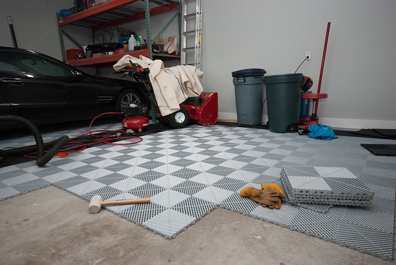 DSC_0602.jpg - Actually laying down the tiles doesn't take much time, but  shuffling around all the garage junk can.  The rubber mallet is for tapping down the tile edges.