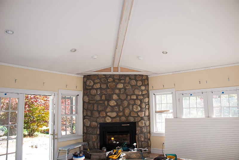 DSC_1040.jpg - The 2-1/4 inch crown molding converges over the fireplace.  A soffit will smooth the transition to the irregular stone.