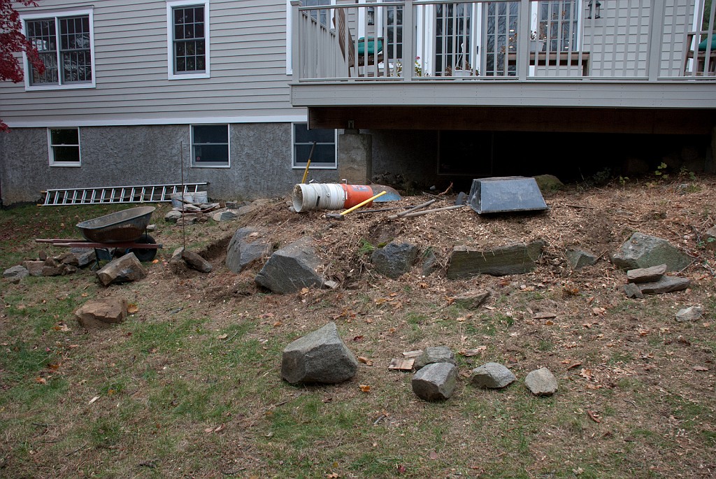 DSC_8266.jpg - The jumble of rocks left around the deck are moved away.