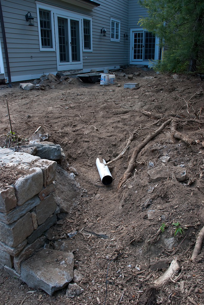 DSC_8591.jpg - The east roof and patio drain will discharge in to the backyard here.