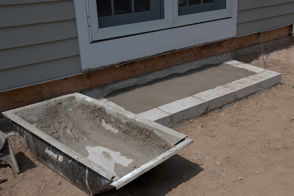 DSC_8599.jpg - Austin poured the base for the east patio doors.