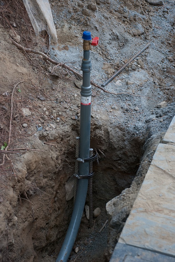 DSC_8685.jpg - The gas pipe is secured at the outlet end by rebar.