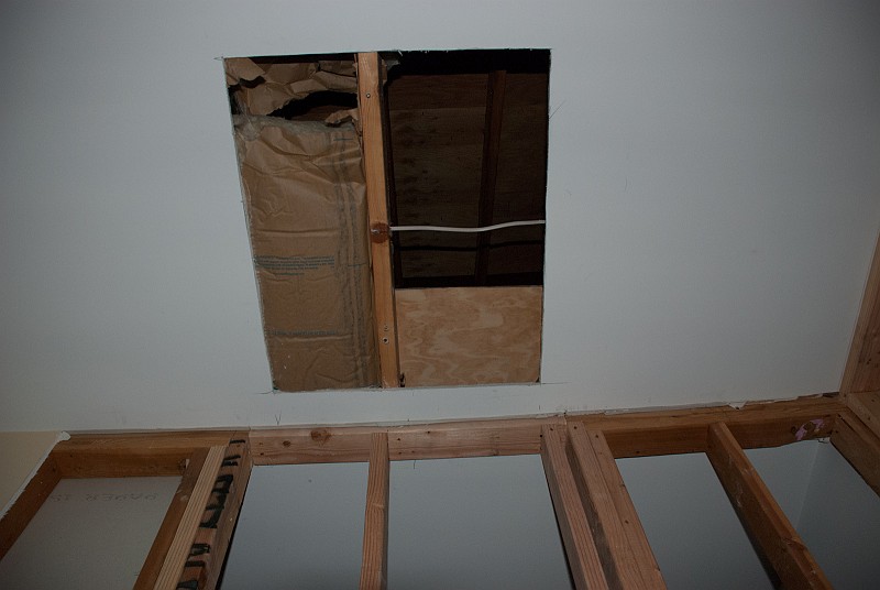 DSC_9477.jpg - The sheetrock is cut for the attic ladder hatch.