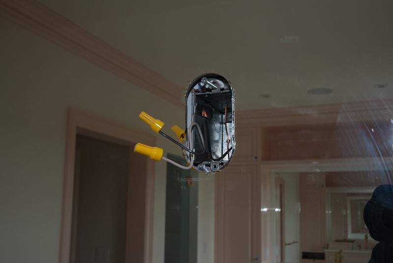 DSC_2403.jpg - In the master bath, I removed the rectangular plastic plates to reveal very crudely-cut holes in the mirrors, like the one pictured.  I became concerned re further mirror cracking and the ensuing seven years of bad luck.