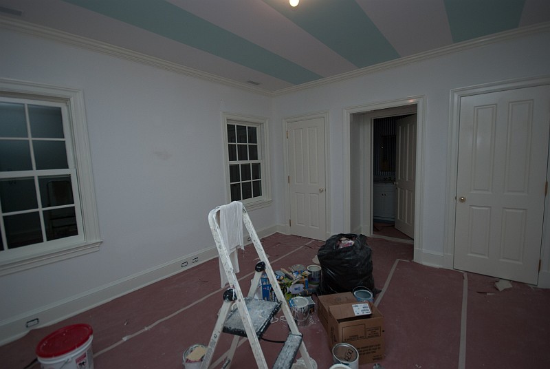 DSC_2731.jpg - The upstairs front bedroom receives paint on the doors and trim.  The striped ceiling will get painted soon.
