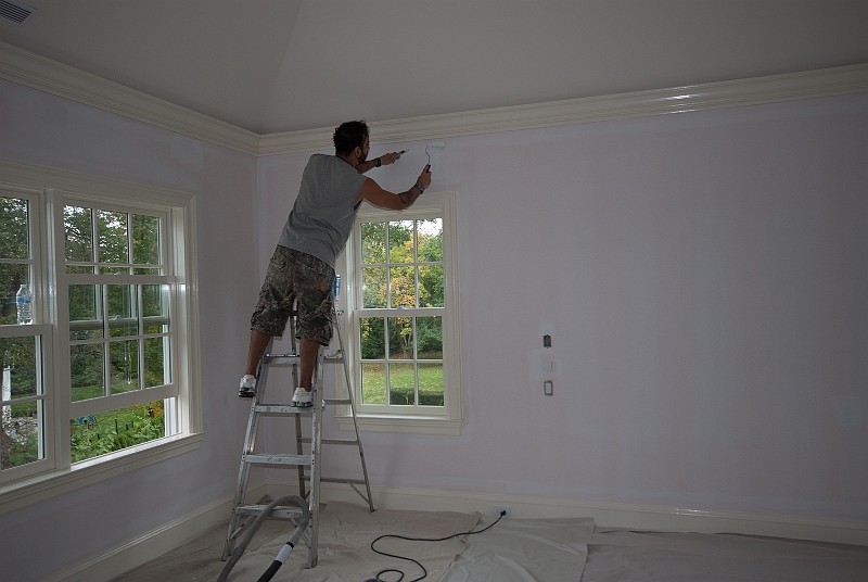 DSC_2748.jpg - Painter Danny is working on the master bedroom walls.
